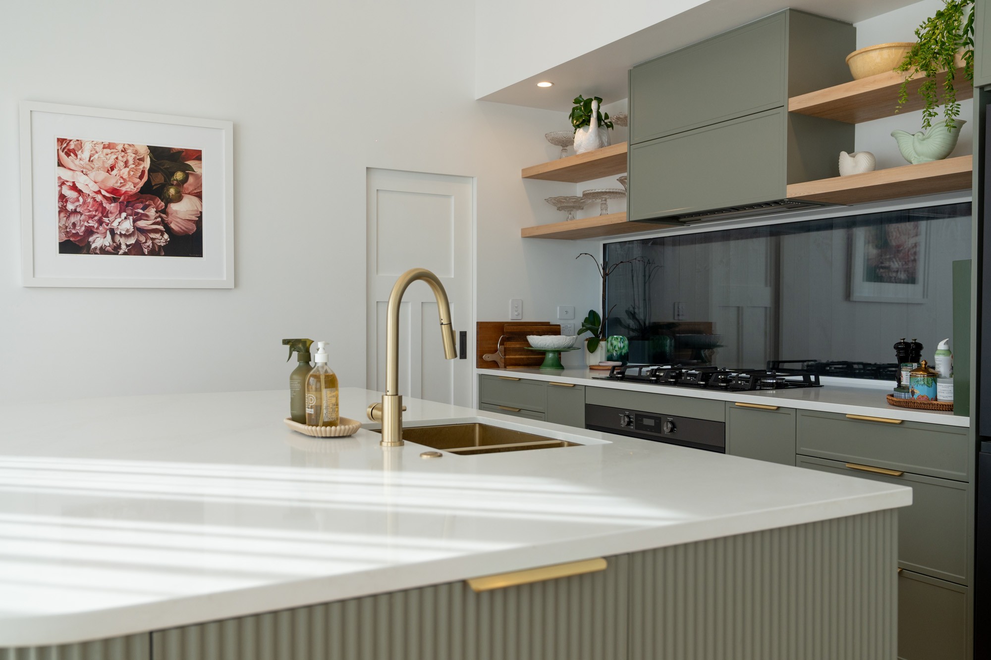 Anders brand wordmark in white placed on top of an image of a modern interior design.