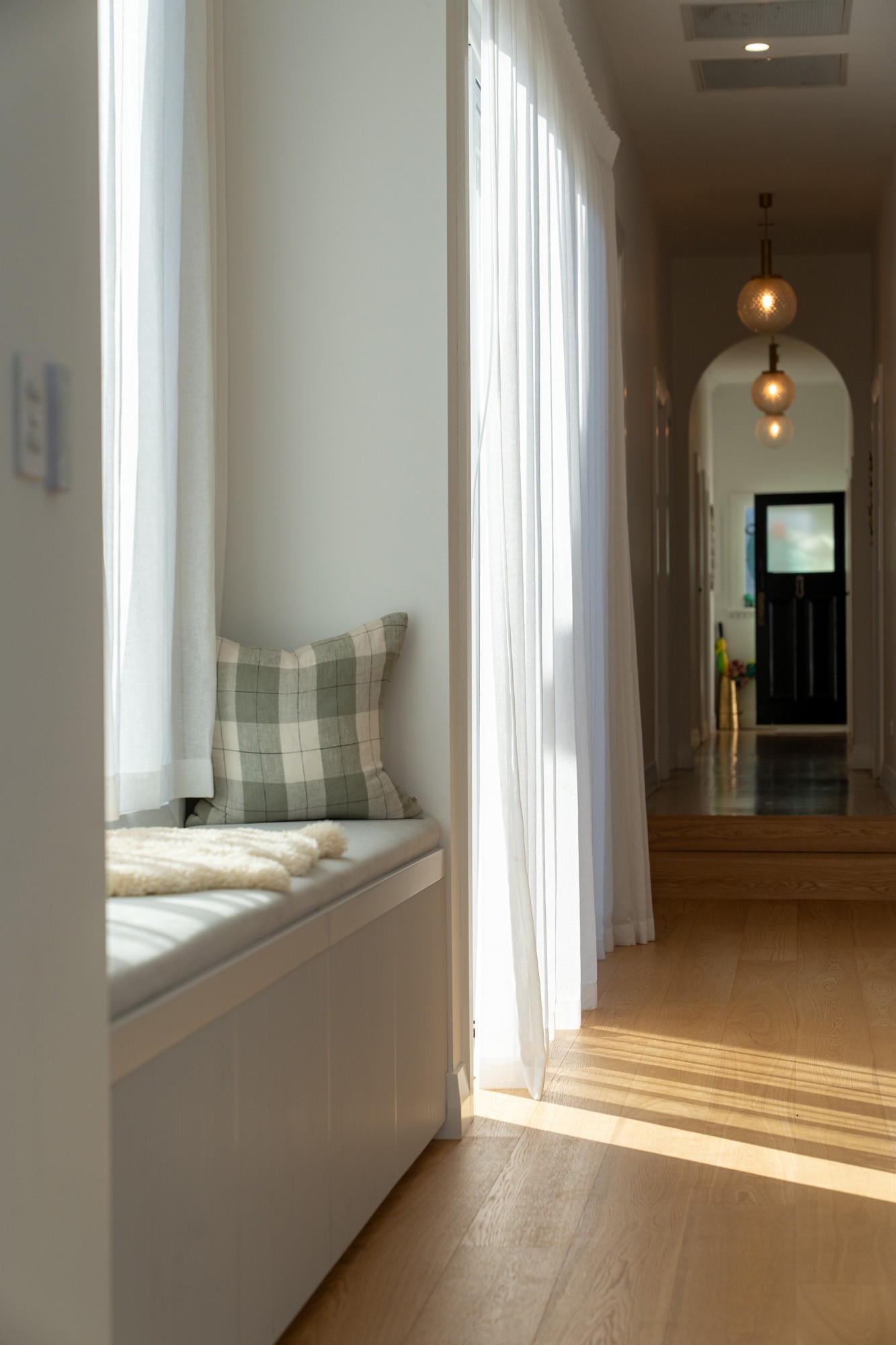 Graphic depicting UI-styled buttons with different categories of interior design items on top of an image of a modern interior living room.