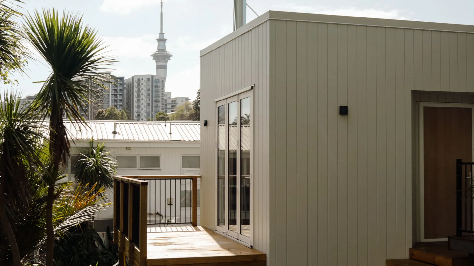 Anders brand wordmark in white placed on top of an image of a modern interior design.
